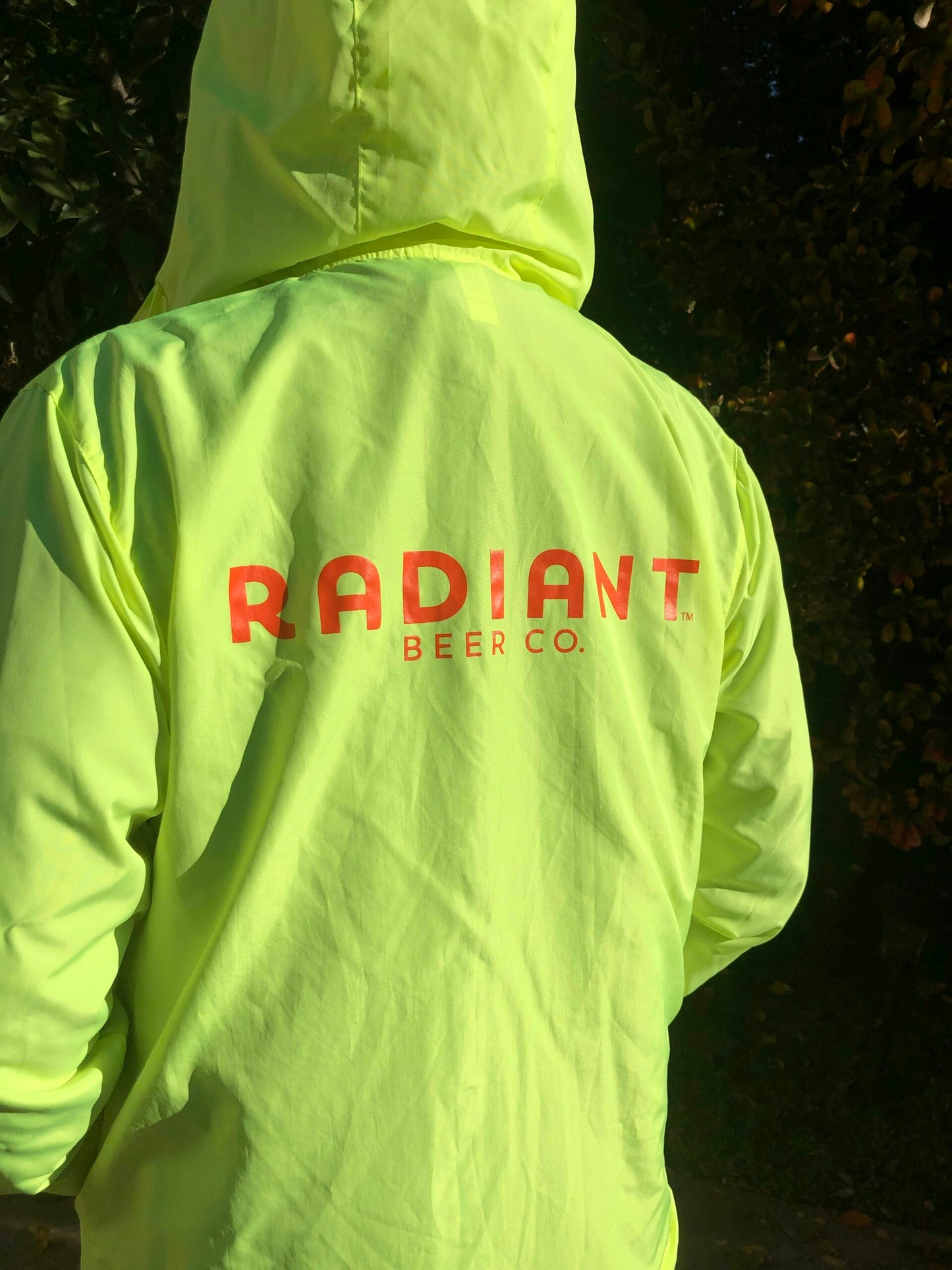 Neon windbreaker with orange radiant logo