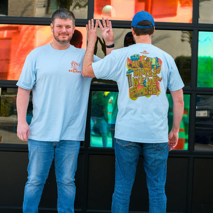 Staff Members showcase the All The Thing's We've Done Anniversary t-shirt