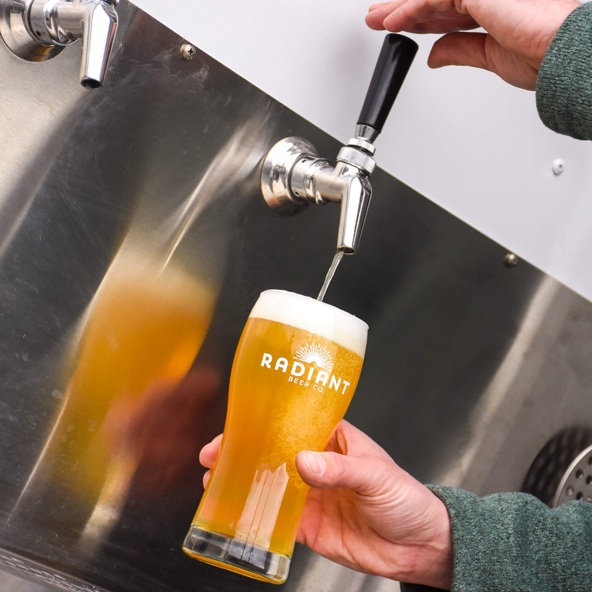 Beer is poured from a trailer on the back patio into a fresh pint 