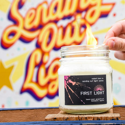 First Light candle featuring lemon peel, grapefruit, mandarin, and agave
